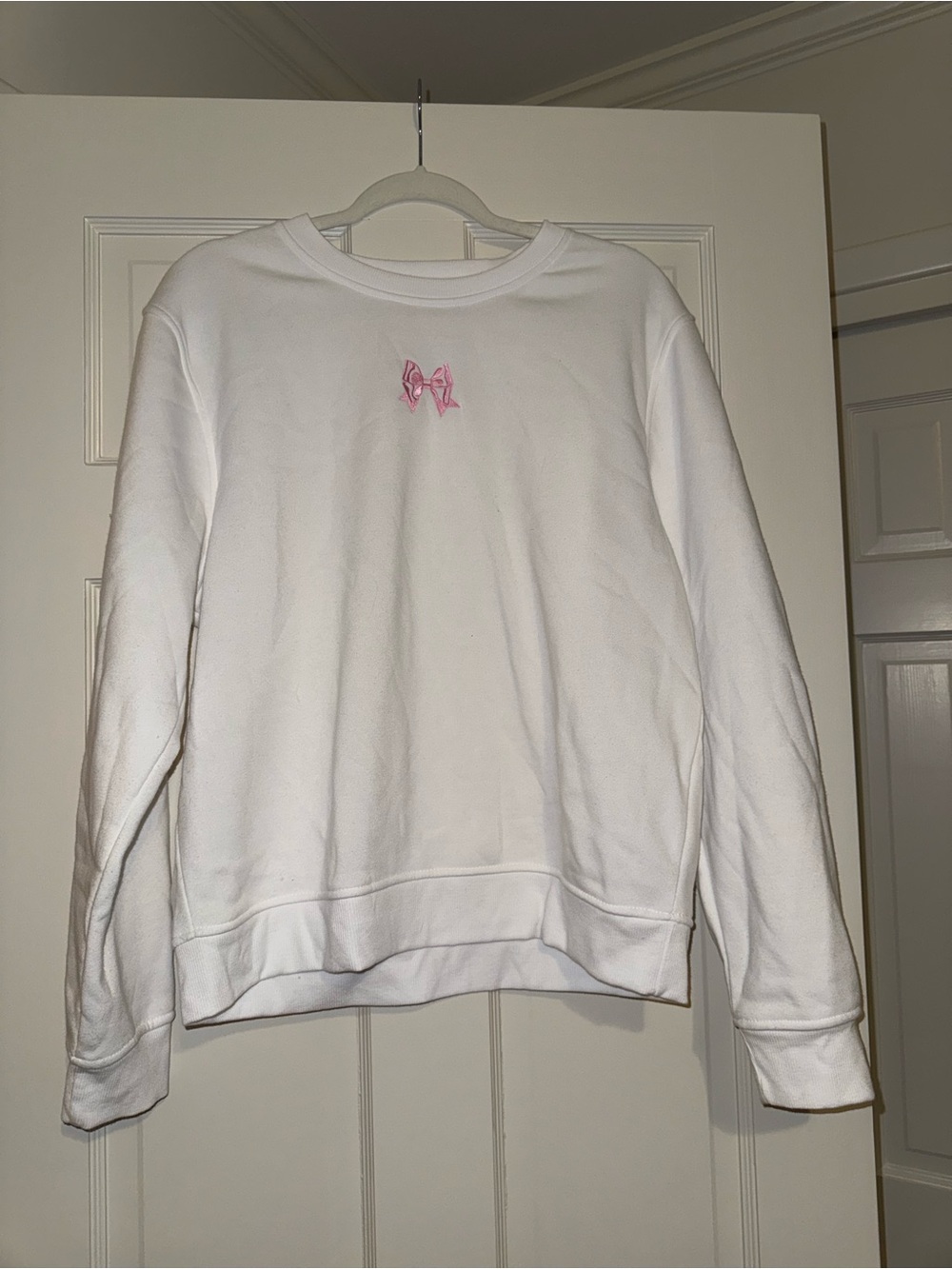 White Crewneck Sweater with Pink Bow Accent